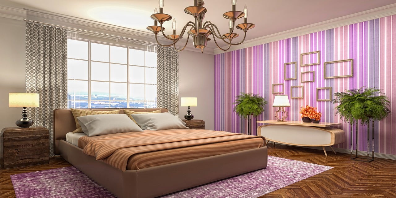 Luxurious bedroom with soft beige tones, layered lighting, and premium bedding, skillfully designed by an interior designer for bedroom comfort and elegant ambiance.