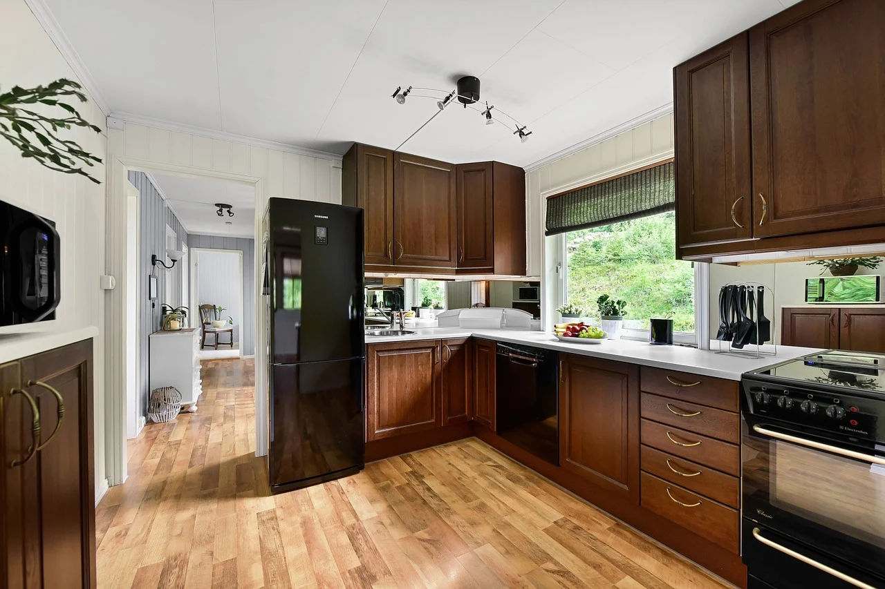 When designing your kitchen cupboards for small kitchens, color, and material choices play a huge role in making the space feel larger and brighter.